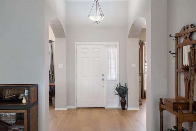 foyer entrance with light hardwood / wood-style floors