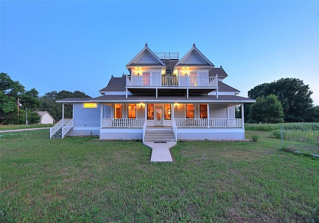 view of front of house featuring a porch and a yard