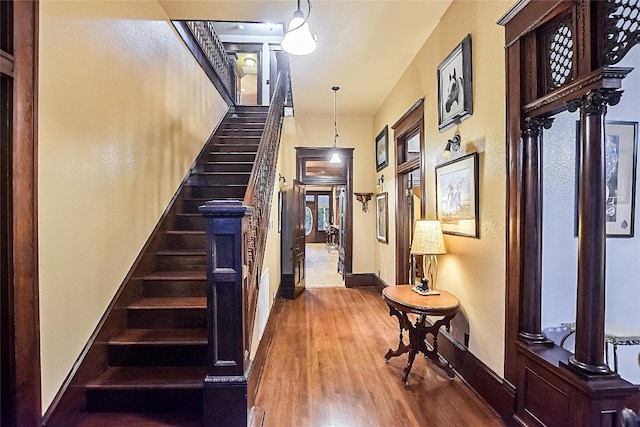 stairway with hardwood / wood-style flooring