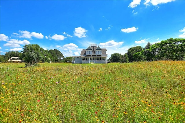 rear view of property featuring a rural view