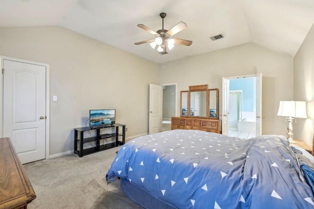 bedroom featuring lofted ceiling, light carpet, ceiling fan, and ensuite bathroom