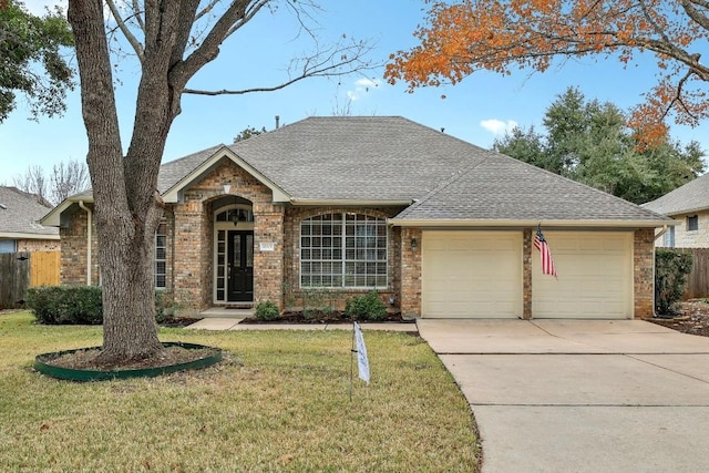 ranch-style house with a garage and a front lawn