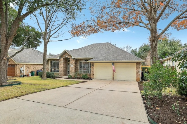 single story home with a garage and a front lawn