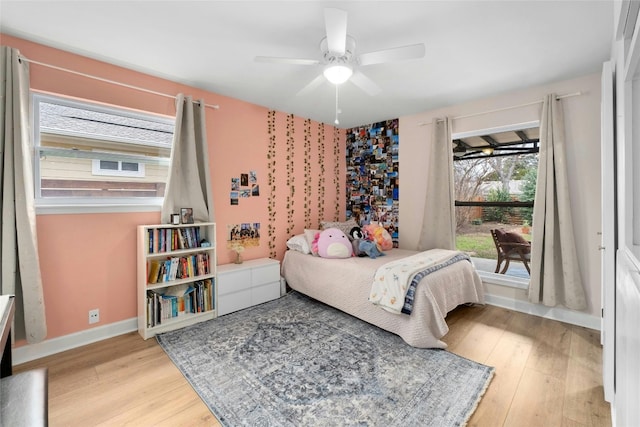 bedroom featuring ceiling fan and light hardwood / wood-style floors