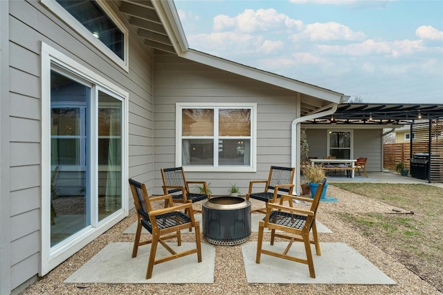 view of patio / terrace with area for grilling and an outdoor fire pit