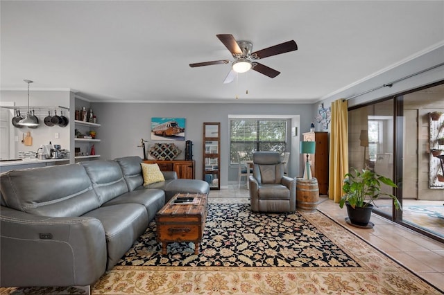 tiled living room featuring crown molding and ceiling fan