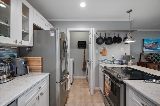 kitchen with white cabinetry, stainless steel electric stove, decorative light fixtures, and crown molding