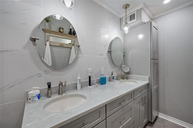 bathroom featuring ornamental molding and vanity