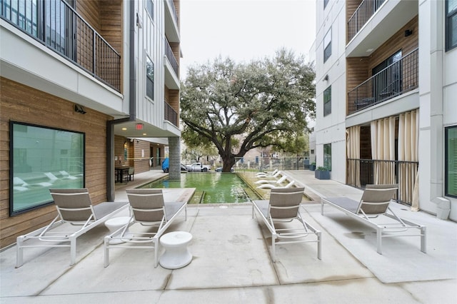 view of patio featuring a water view