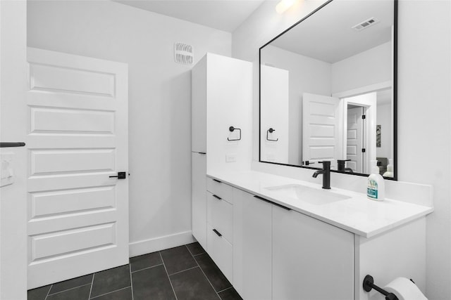 bathroom with tile patterned flooring and vanity