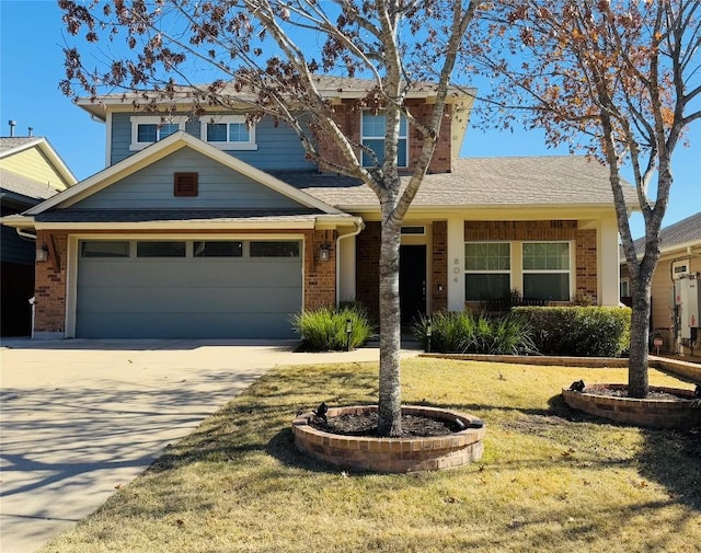 view of front of property featuring a garage and a front yard