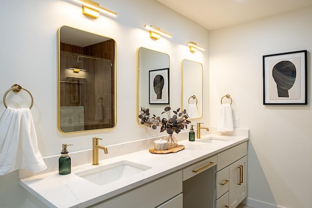 bathroom with vanity and tiled shower