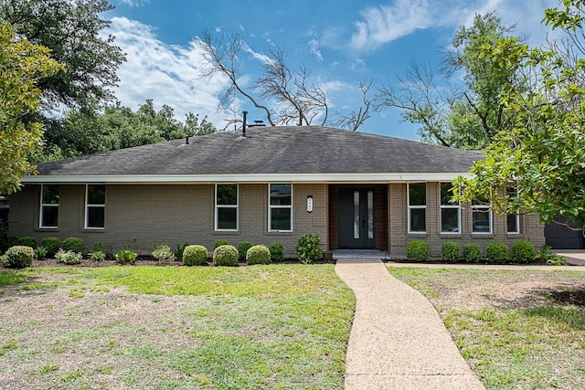 ranch-style house with a front lawn