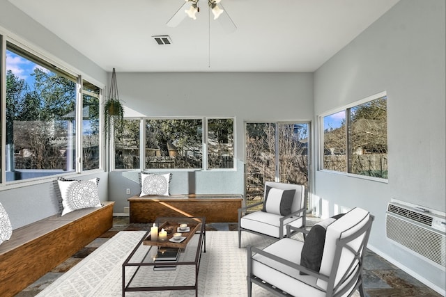 sunroom featuring ceiling fan