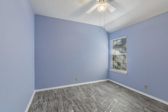 unfurnished room featuring hardwood / wood-style flooring, lofted ceiling, a textured ceiling, and ceiling fan