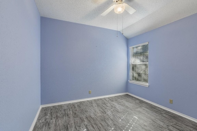 1212 Dove Cir, Cedar Park, TX 78613 - unfurnished room with a textured ceiling, wood finished floors, ceiling fan, baseboards, and vaulted ceiling