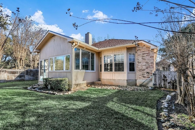 1212 Dove Cir, Cedar Park, TX 78613 - view of home's exterior with a chimney and a sunroom