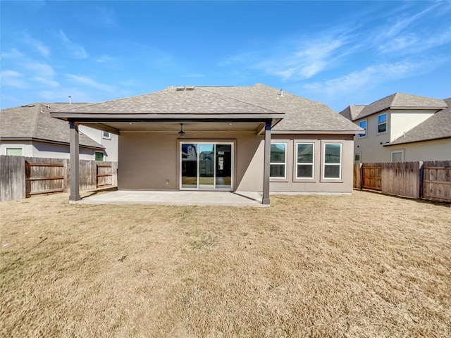 17401 Howdy Way, Manor, TX 78653 - back of house with a ceiling fan, a shingled roof, a patio, and stucco siding