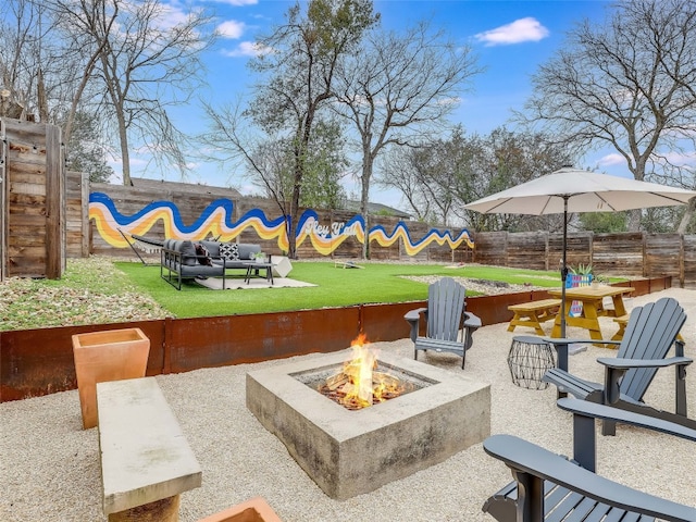 view of patio / terrace with a fire pit