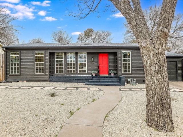 single story home with a garage