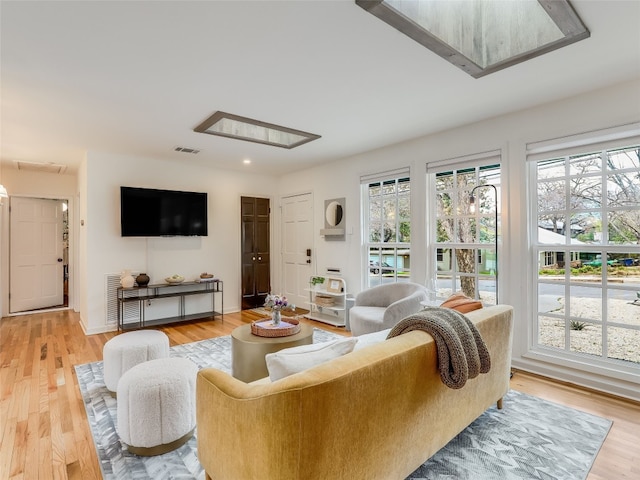 living room with light hardwood / wood-style floors