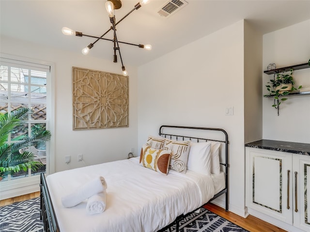 bedroom featuring hardwood / wood-style flooring