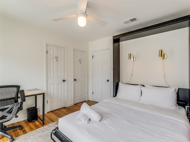 bedroom with ceiling fan and light wood-type flooring