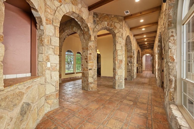 hallway with beamed ceiling