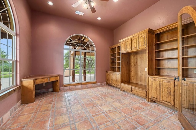 interior space featuring ceiling fan