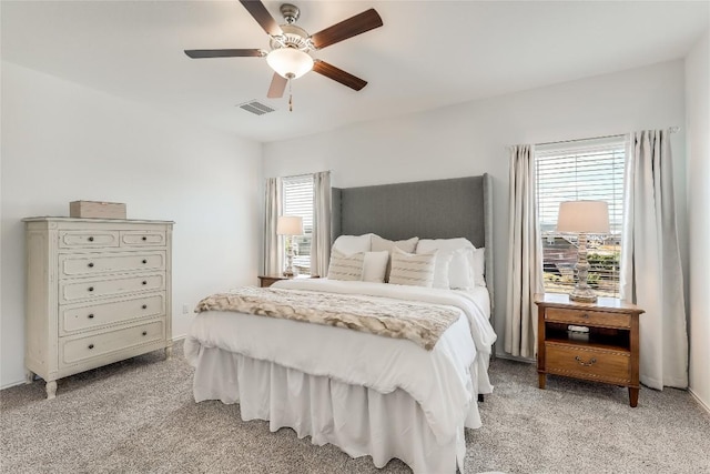 bedroom with light colored carpet and ceiling fan