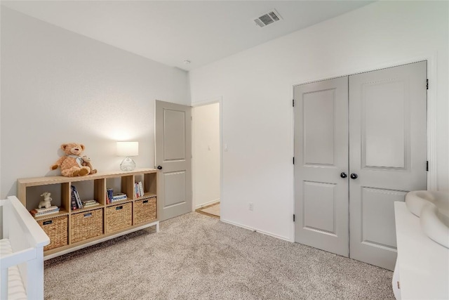 carpeted bedroom featuring a closet