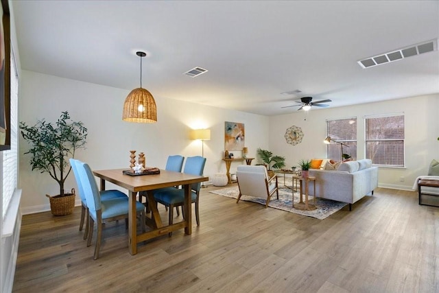 dining room featuring hardwood / wood-style floors and ceiling fan