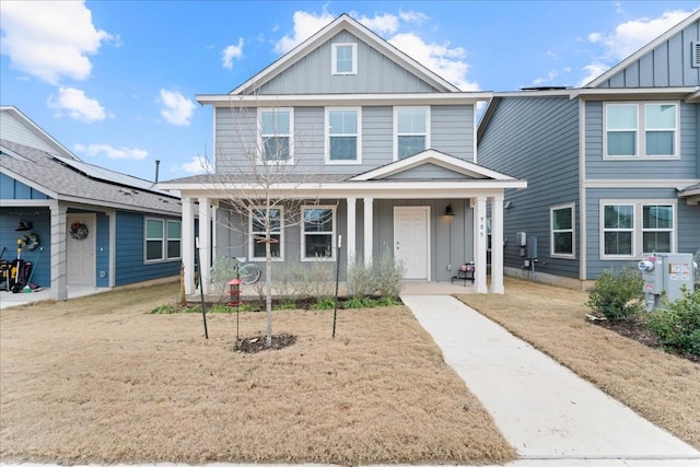 view of front of property with a porch and a front yard