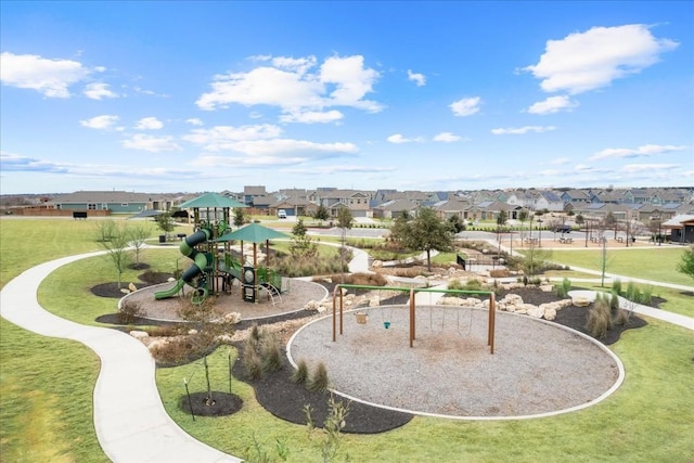 view of home's community featuring a yard and a playground