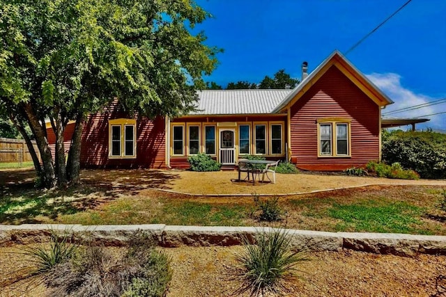 back of house featuring a yard