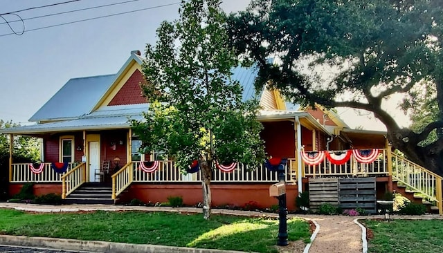 1307 Wright St, Llano, TX 78643 - view of front of home with a porch and stairs
