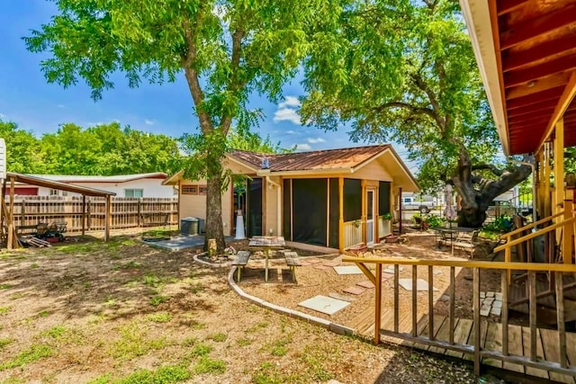 back of property featuring central AC unit