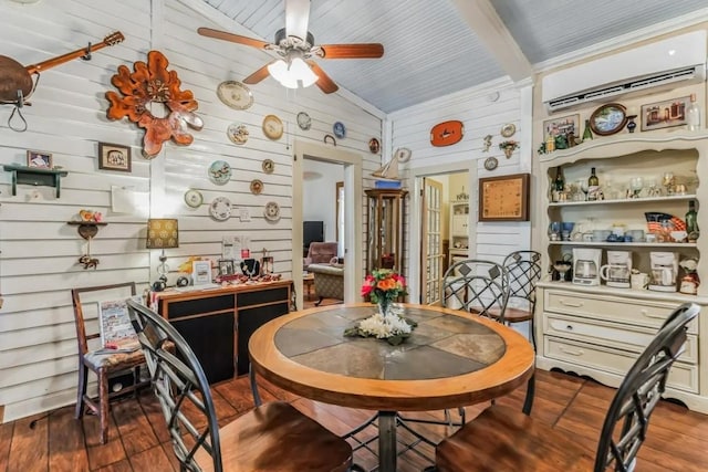 dining space featuring vaulted ceiling with beams, ceiling fan, hardwood / wood-style floors, and an AC wall unit