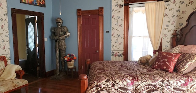 1307 Wright St, Llano, TX 78643 - bedroom featuring wood finished floors and wallpapered walls