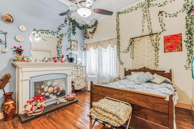 bedroom featuring wood-type flooring and ceiling fan