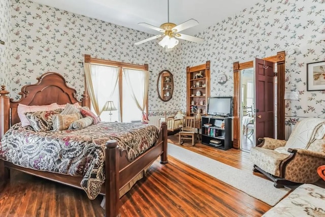 1307 Wright St, Llano, TX 78643 - bedroom featuring wallpapered walls, wood finished floors, and ceiling fan