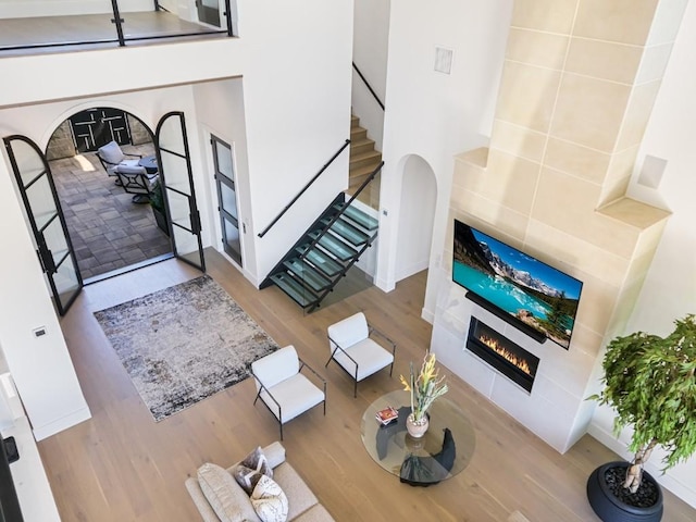 living room with a fireplace and light hardwood / wood-style flooring