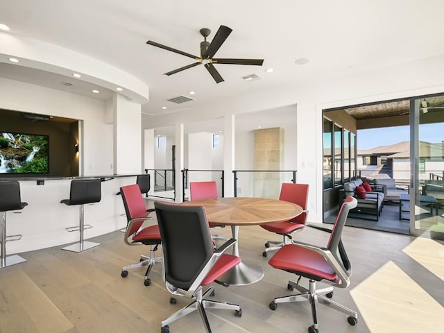 home office with light hardwood / wood-style flooring