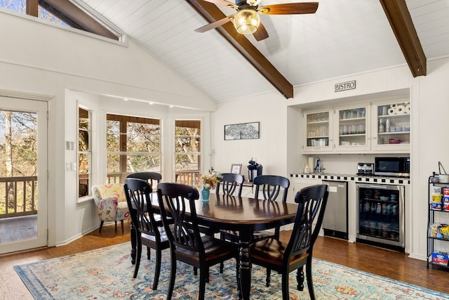 dining space with wood ceiling, bar area, lofted ceiling with beams, dark hardwood / wood-style flooring, and beverage cooler