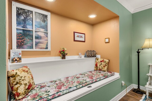 sitting room featuring crown molding and wood-type flooring