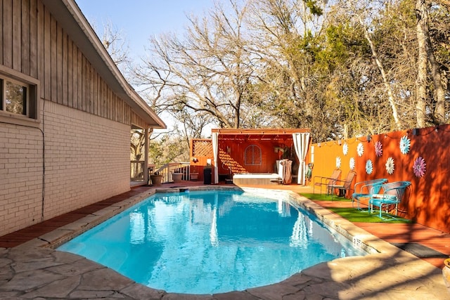 view of pool with a wooden deck