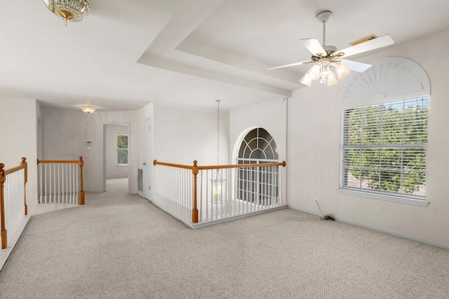 unfurnished room with ceiling fan and carpet flooring