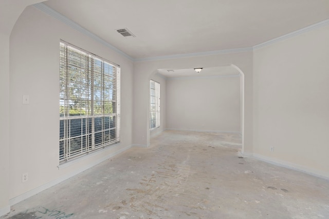 702 Timarron Dr, Leander, TX 78641 - spare room featuring arched walkways and ornamental molding