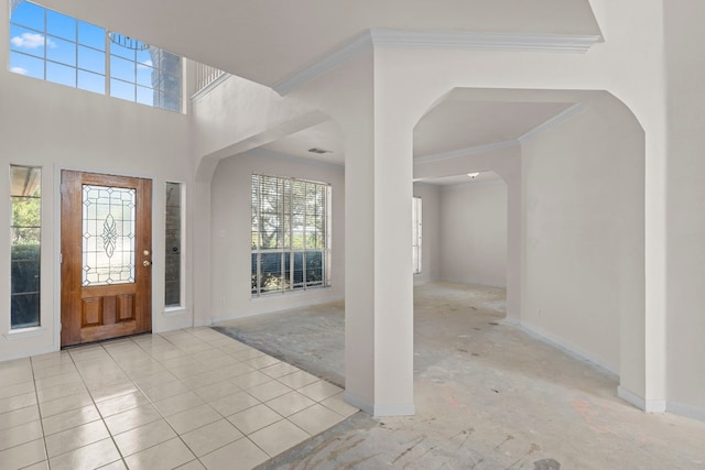 702 Timarron Dr, Leander, TX 78641 - entrance foyer with plenty of natural light, ornamental molding, and arched walkways