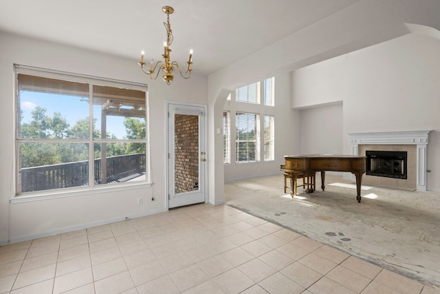 foyer with light colored carpet and a chandelier